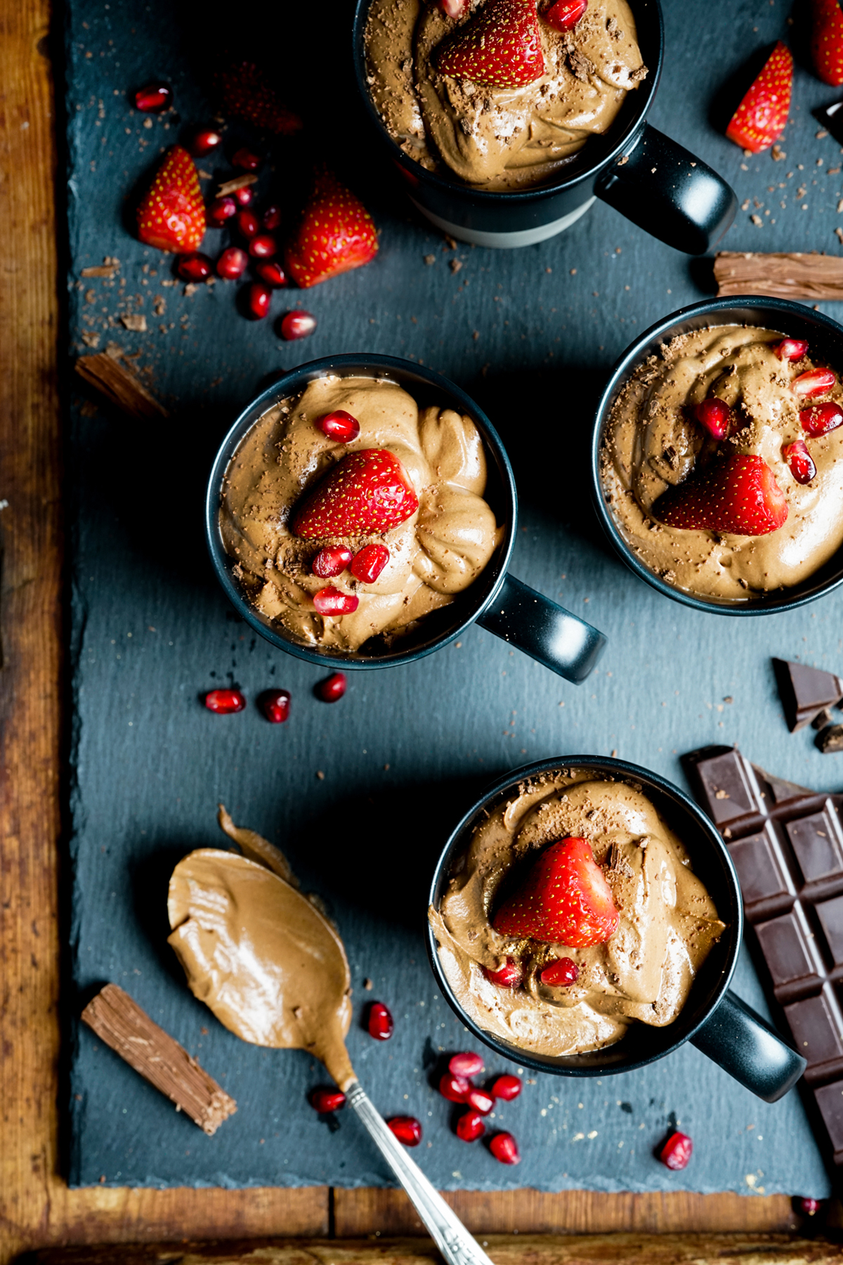 mugs fill of chocolate mousse topped with strawberries