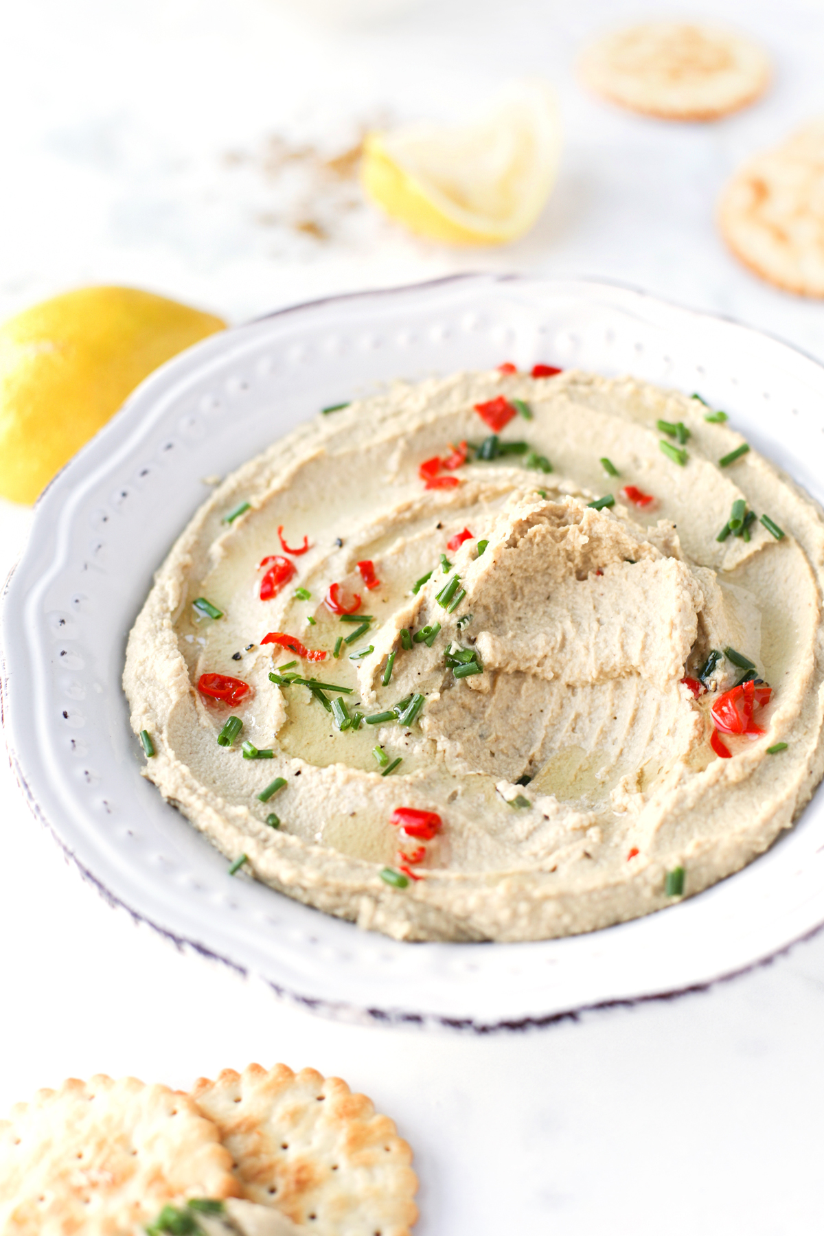 Hummus sprinkled with herbs and chilli